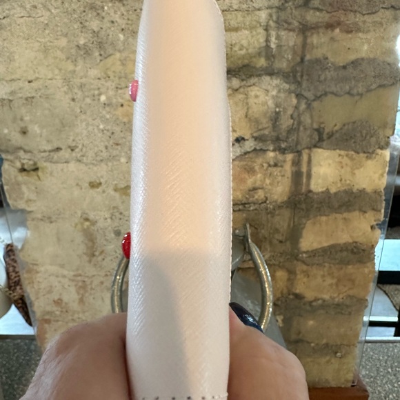 Kate Spade wallet is a light pink wallet adorned with small heart-shaped studs - Picture 9 of 16